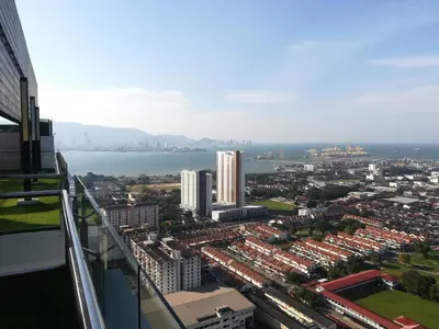 an aerial view of a city and the water at Mevin Woodsbury Butterworth Homestay in Butterworth