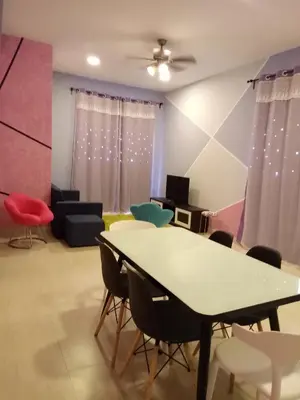 a meeting room with a table and chairs at ICOLOR HOME & STAY CH2 in Tanah Rata