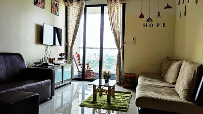 a living room with a couch and a table at Mevin Woodsbury Suite Butterworth Penang in Butterworth