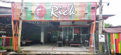 a building with a sign that reads pink rage at Rick Resort Teluk Intan in Teluk Intan