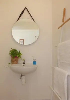 a bathroom with a sink and a mirror at Minima 8 in George Town