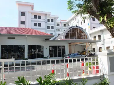 a building with a car parked in front of it at Minima 8 in George Town