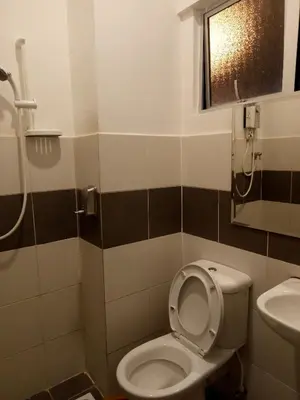 a bathroom with a toilet and a sink at NATURE @ FOREST CAMERON 15 in Tanah Rata