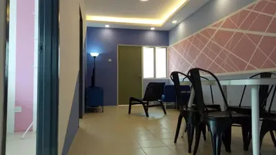 a dining room with two chairs and a table at SKY PURPLE @CH in Tanah Rata