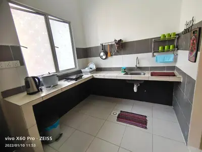 a small kitchen with a sink and a window at CLASSIC ENGLISH @ CH in Tanah Rata
