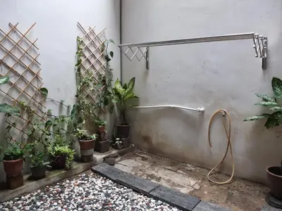 a bathroom with a shower with plants in it at Muntri House by Virtue Hospitality in George Town