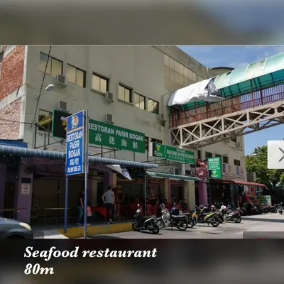 a group of motorcycles parked in front of a building at coralbay apartment pangkor island in Pangkor