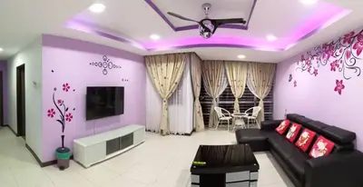a living room with a couch and a tv at Sekinchan Paddy via Seaview Home \u9ad8\u697c \u770b\u6d77 \u7a3b\u7530 \u6c11\u5bbf in Sekincan