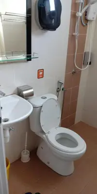 a bathroom with a toilet and a sink at Sekinchan Theme Design Penthouse 16-30Ppax \u4e3b\u9898\u9876\u5c42\u516c\u5bd3\u6c11\u5bbf in Sekincan