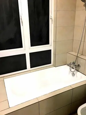 a bathroom with a shower and a sink and two windows at Excellent Location Octagon Studio at Palo 101 Ipoh in Ipoh