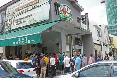 a crowd of people standing outside of a store at Excellent Location Octagon Studio at Palo 101 Ipoh in Ipoh