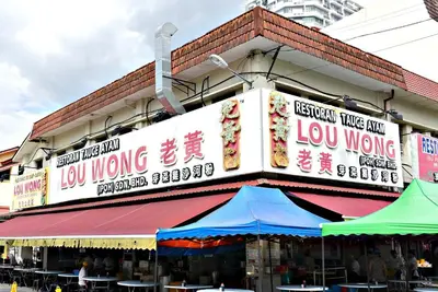 a building with signs on the side of it at Excellent Location Octagon Studio at Palo 101 Ipoh in Ipoh