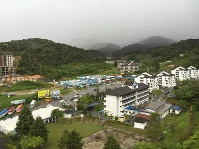 an aerial view of a city with a parking lot at Cameron Supersave Apartment @ Crown Imperial Court in Brinchang