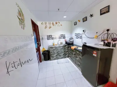 a kitchen with a sink and a counter top at Sea & Wave #2 Coral Bay Apartment in Pangkor