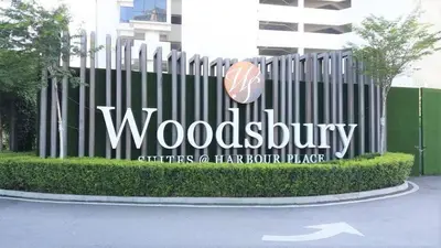 a woodenbury sign in front of a building at Woodsbury Suites 7722 Butterworth Penang in Butterworth