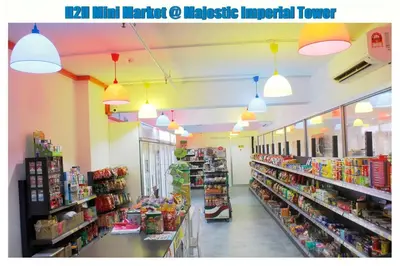 a grocery store aisle with pendant lights in a store at H2H - Eleven14 Majestic Ipoh in Ipoh
