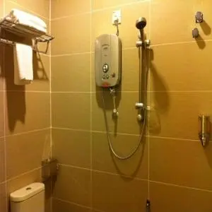 a shower in a bathroom with a toilet at The Regency Garden Hotel in Ipoh