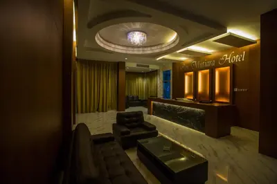 a lobby with a waiting room with a couch and a table at Hotel Pen Mutiara in Kampong Batu Maung