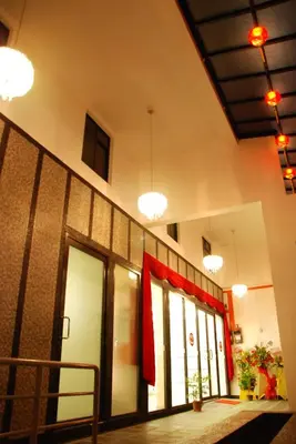 a lobby with a row of doors and windows at Old Penang Hotel - Penang Times Square in George Town