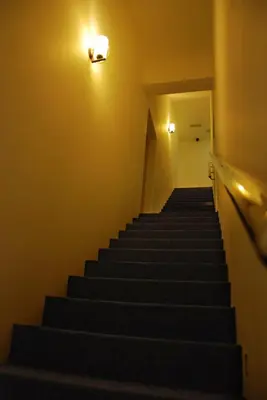 a set of stairs in a hallway with a light at Old Penang Hotel - Penang Times Square in George Town