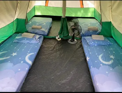 a inside of a tent with two beds in it at Outworld Basecamp in Gopeng