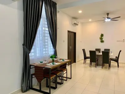 a dining room with a table and chairs at BRAND NEW Cosy Minimalist Home in Butterworth