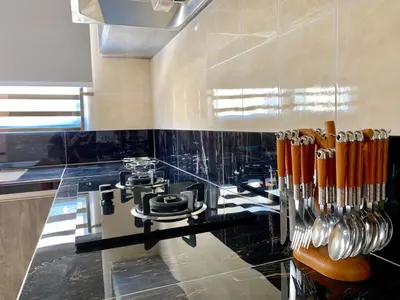 a kitchen with a counter with utensils on it at BRAND NEW Cosy Minimalist Home in Butterworth