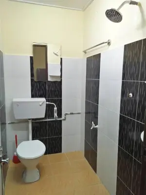 a bathroom with a toilet and a shower at Homestay / Roomstay Muslim Budget Tanjung Malim in Tanjung Malim
