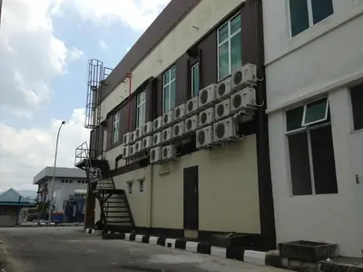 a building with a staircase on the side of it at Hotel Checkedinn in Ipoh