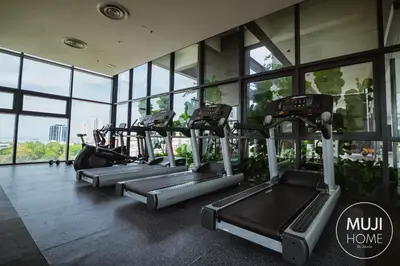 a row of treadmills in a gym with windows at Muji X Tiffany - City and Hill View 3BR at 218 Tropicana NEAR Komtar Food Heaven with Netflix & TV Box in George Town