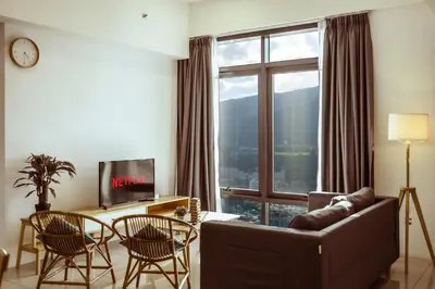 a living room with a couch and a large window at Muji X Tiffany - City and Hill View 3BR at 218 Tropicana NEAR Komtar Food Heaven with Netflix & TV Box in George Town