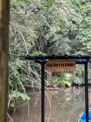 a table with a keyboard on it next to a body of water at Xscape Tambun in Ipoh