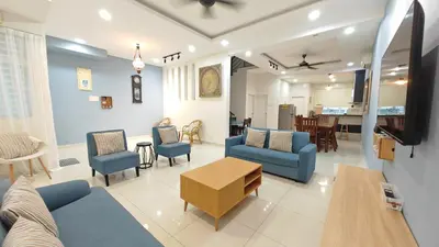 a living room with blue chairs and a table at Ocean 25 Shamrock Beach Big Group 6 Bedroom 5 Bathroom with Pool in Tanjung Bungah