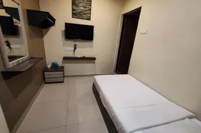 a hospital room with a bed and a flat screen tv at Heaven Mountain Hill Hotel 1 Cameron Highlands in Cameron Highlands