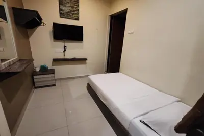 a hospital room with a bed and a flat screen tv at Heaven Mountain Hill Hotel 1 Cameron Highlands in Cameron Highlands