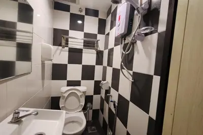 a bathroom with a black and white checkered wall at Heaven Mountain Hill 2 Cameron Highlands in Cameron Highlands