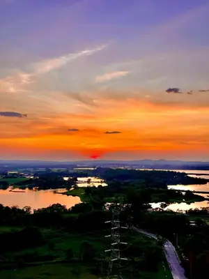 a sunset over a body of water with the sky at Kampar Champs Elysees, King Bed Studio unit 12A21 in Kampar