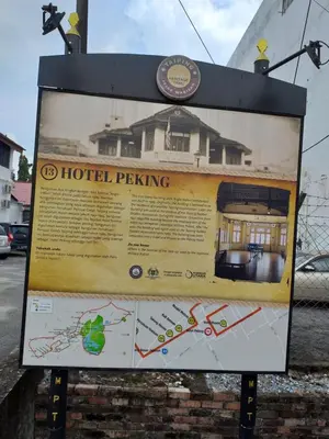 a sign for a hotel parking lot at Hotel Peking in Taiping