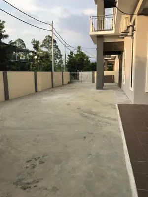 an empty parking lot next to a building at Family Homestay in Taiping