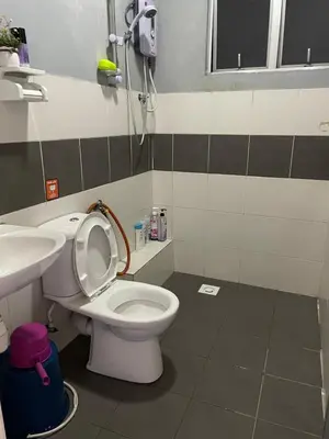 a bathroom with a toilet and a sink at Cameron Lavender Homestay in Cameron Highlands