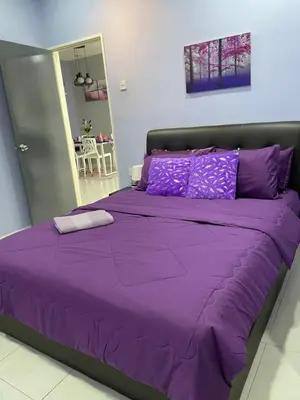 a purple bed with purple sheets in a bedroom at Cameron Lavender Homestay in Cameron Highlands