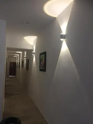 a hallway with a row of lights on the wall at COMFORTABLE STAY in Ayer Itam