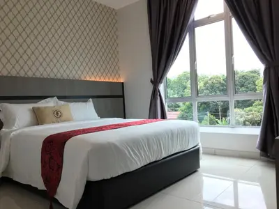 a bedroom with a bed and a large window at B&L HOTEl in Sungkai