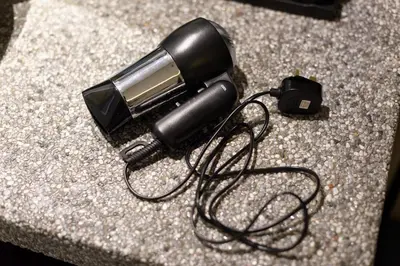 a blow dryer sitting on top of a counter at Sojourn Spa Hotel Ipoh in Ipoh