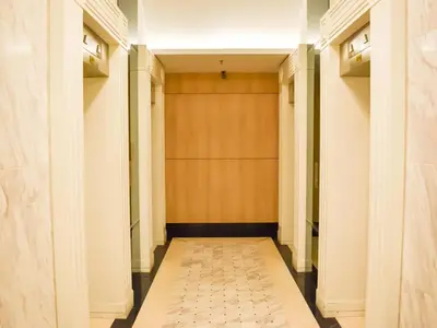 a hallway with a bench in the middle of a building at Mansion One, Private Room in George Town