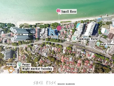 a map of a city with buildings and the ocean at Smell rose beach garden in Batu Ferringhi