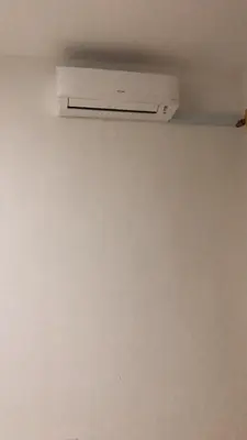 a air conditioner on a ceiling in a room at Hasnifana Homestay Seri Iskandar in Seri Iskandar