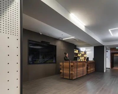 a man is standing at a counter in a room at Loop On Leith George Town Penang Hotel in George Town