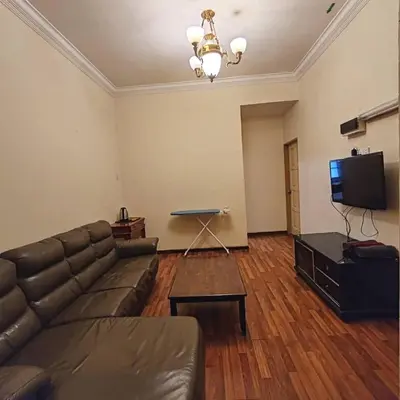 a living room with a couch and a flat screen tv at Super Budget 3 Rooms Apartment @ Brinchang Town in Brinchang
