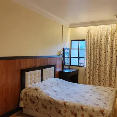 a bedroom with a bed and a window at Super Budget 3 Rooms Apartment @ Brinchang Town in Brinchang